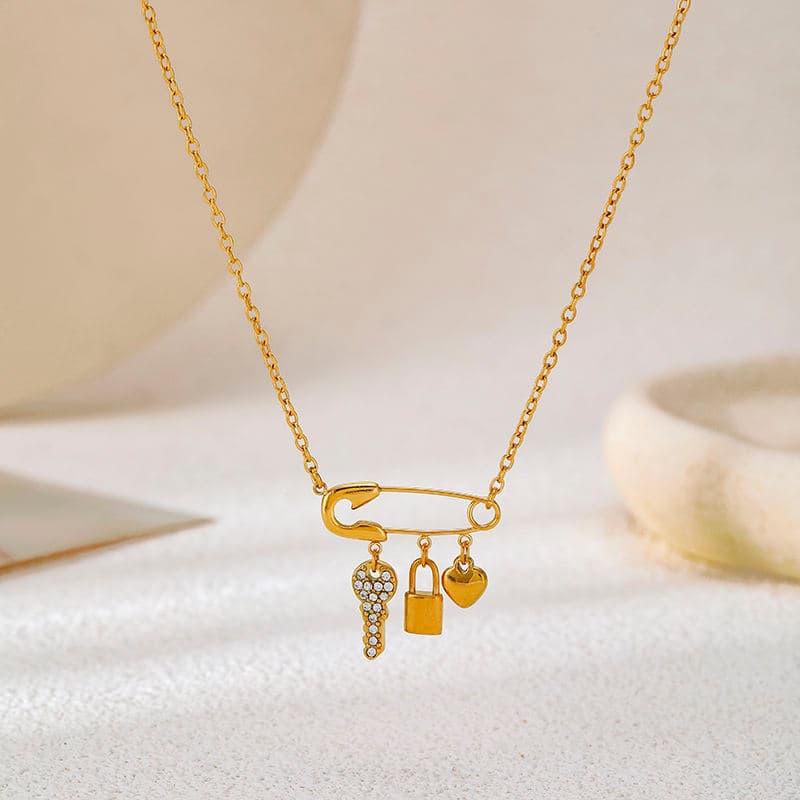 Luna Safety Pin Charm Necklace – 18K Gold Plated Lock, Key & Heart Pendant Chain hover