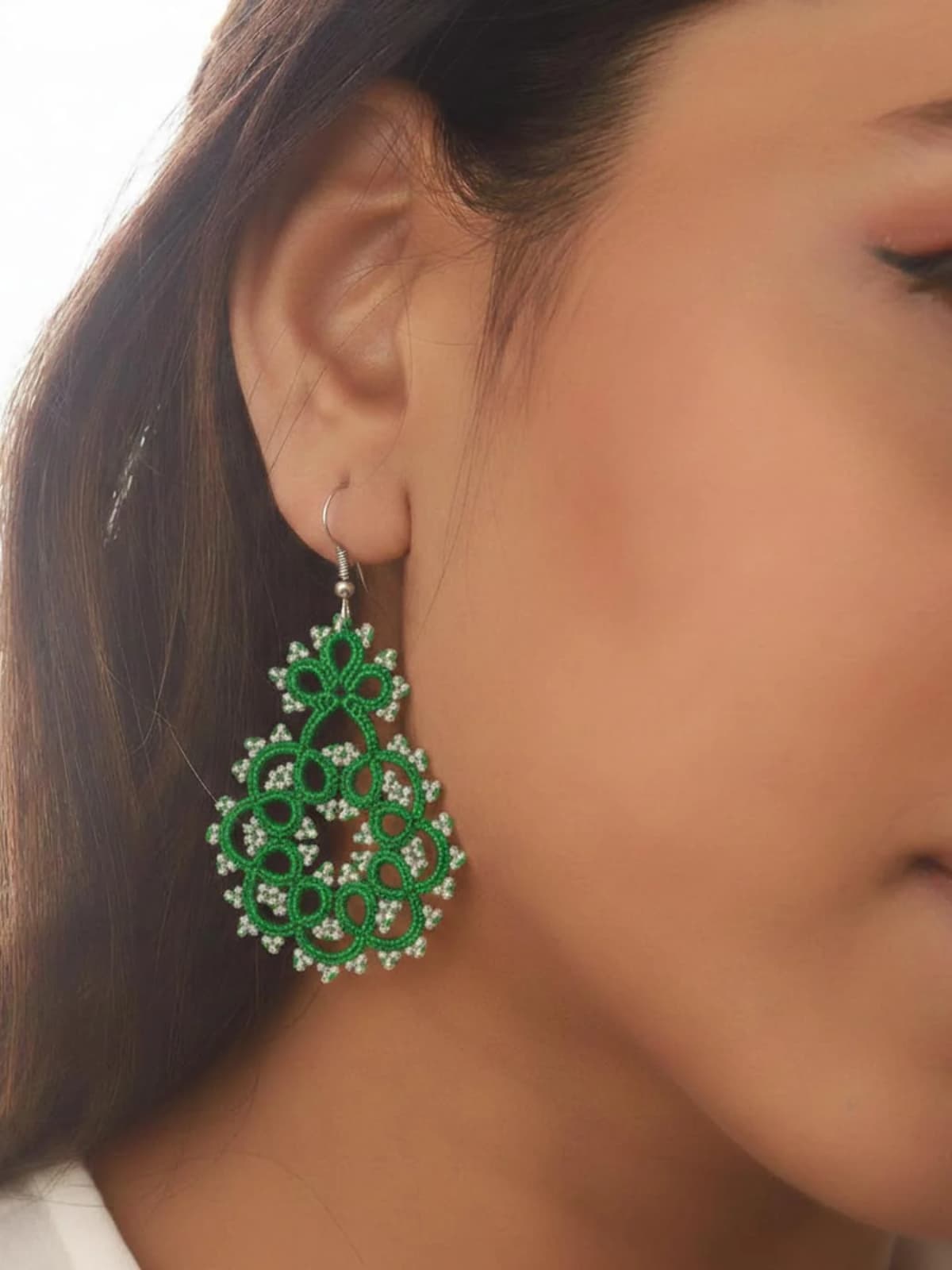 Emerald Whirl Earrings hover